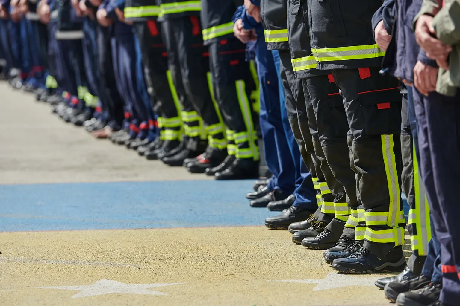 First responders standing together — police, fire & EMS